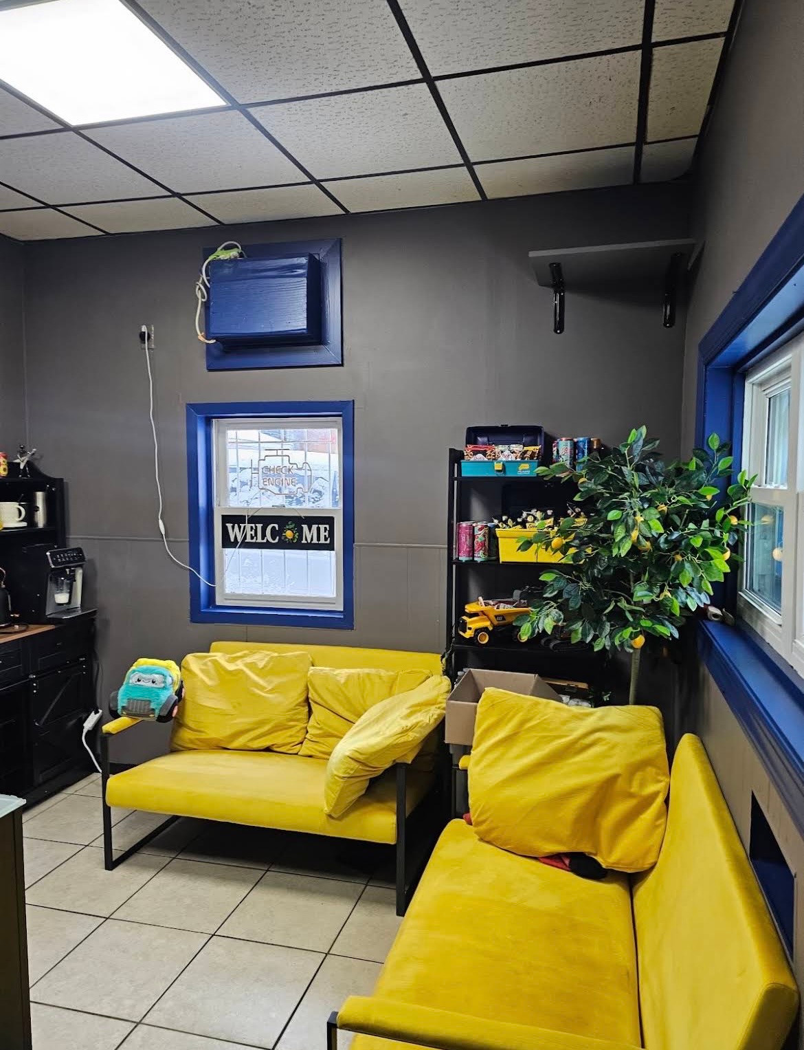 Inside Light Auto Sales: waiting area with yellow seating