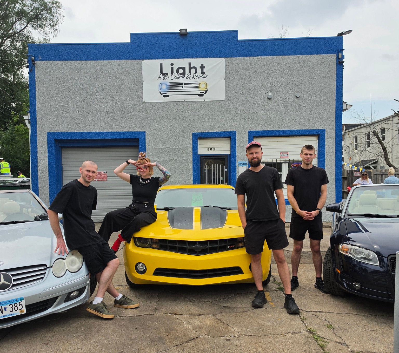 The Light Auto Sales team outside our Saint Paul location