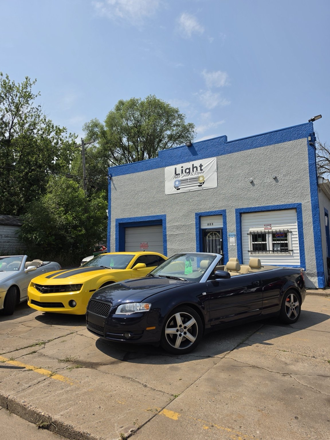 Vehicles outside the Light Auto Sales building